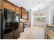 Modern kitchen featuring wood cabinets and granite countertops at 1008 Blue Heron Way, Tarpon Springs, FL 34689