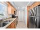 Updated kitchen with stainless steel appliances and granite countertops at 14300 Gulf Blvd # 206, Madeira Beach, FL 33708