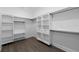 Large walk-in closet with ample shelving and hanging space at 19581 Sheltered Hill Dr, Brooksville, FL 34601