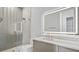 Modern bathroom with glass shower, vanity, and illuminated mirror at 2201 N Glenwood Dr, Tampa, FL 33602