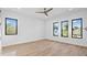 Bright bedroom with three windows and hardwood flooring at 2201 N Glenwood Dr, Tampa, FL 33602