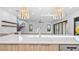 Modern kitchen featuring quartz countertops, stainless steel appliances, and an open floor plan at 2201 N Glenwood Dr, Tampa, FL 33602