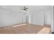 This spacious bedroom features a ceiling fan, recessed lighting, and sleek hardwood floors at 2201 N Glenwood Dr, Tampa, FL 33602