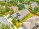 Aerial view of house nestled in a tranquil waterfront community at 1008 Blue Heron Way, Tarpon Springs, FL 34689