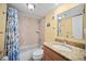 Updated bathroom with tub and granite vanity at 14300 Gulf Blvd # 206, Madeira Beach, FL 33708