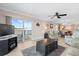 Spacious living room with ocean view and sliding glass doors at 14300 Gulf Blvd # 206, Madeira Beach, FL 33708