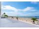 Beachfront lounge chairs with ocean view at 14300 Gulf Blvd # 206, Madeira Beach, FL 33708