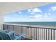 Stunning ocean view from balcony with chairs at 14300 Gulf Blvd # 206, Madeira Beach, FL 33708