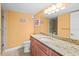 Bathroom with granite countertop and shower at 14300 Gulf Blvd # 206, Madeira Beach, FL 33708