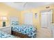 Bedroom with two twin beds and closet at 14300 Gulf Blvd # 206, Madeira Beach, FL 33708