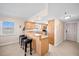 Kitchen with breakfast bar and granite countertops at 14300 Gulf Blvd # 206, Madeira Beach, FL 33708