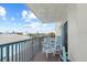 Balcony with patio furniture and ocean view at 14300 Gulf Blvd # 206, Madeira Beach, FL 33708