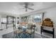 Bright dining room with water views, featuring a glass-top table and seating for four at 11220 9Th E St, Treasure Island, FL 33706