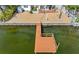Private dock extending into the calm water at 11220 9Th E St, Treasure Island, FL 33706