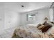 Spacious bedroom with king-size bed and window at 11220 9Th E St, Treasure Island, FL 33706