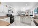 Open kitchen with island and stainless steel appliances at 11220 9Th E St, Treasure Island, FL 33706