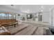 Spacious living room with an open floor plan, offering views of the kitchen and access to waterfront views at 11220 9Th E St, Treasure Island, FL 33706