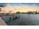 Tranquil waterfront view at sunset, showcasing a private dock and peaceful scenery at 11220 9Th E St, Treasure Island, FL 33706
