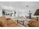 Open living room showcasing a split-level layout with views into the kitchen and dining areas at 11220 9Th E St, Treasure Island, FL 33706