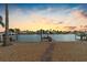 Scenic waterfront property with private dock at sunset at 11220 9Th E St, Treasure Island, FL 33706