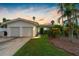 Charming single story home with two car garage and manicured lawn at 11220 9Th E St, Treasure Island, FL 33706