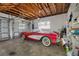 Garage with classic car and ample storage shelving at 11220 9Th E St, Treasure Island, FL 33706