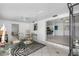 Open dining area with glass-top table and chairs, offering a view into the kitchen and living areas at 11220 9Th E St, Treasure Island, FL 33706