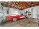 Spacious garage, with classic car and storage at 11220 9Th E St, Treasure Island, FL 33706