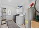 Functional laundry room with washer, dryer, and storage at 11220 9Th E St, Treasure Island, FL 33706
