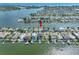 Aerial view showcasing a home's waterfront location in a residential area at 11220 9Th E St, Treasure Island, FL 33706