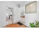 Front entry with tile flooring, laundry & living room view at 11220 9Th E St, Treasure Island, FL 33706