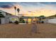 House's backyard at sunset, showing a patio and access to the waterfront at 11220 9Th E St, Treasure Island, FL 33706