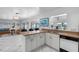 Open kitchen with a breakfast bar overlooking the living room at 11220 9Th E St, Treasure Island, FL 33706