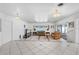 Bright living room with tiled floors and sliding doors to patio at 11220 9Th E St, Treasure Island, FL 33706