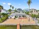 Aerial view showcasing the house's location on the waterfront with a private dock at 11220 9Th E St, Treasure Island, FL 33706