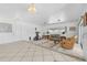 Spacious living room with leather sofas and access to a patio at 11220 9Th E St, Treasure Island, FL 33706