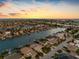 Wide aerial showcasing waterfront homes and community at 11220 9Th E St, Treasure Island, FL 33706