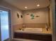 Relaxing bathroom with large soaking tub and double vanity at 3912 Fontainebleau Dr, Tampa, FL 33634