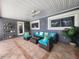 Covered patio furnished with seating and decorative plants at 3912 Fontainebleau Dr, Tampa, FL 33634