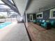 Relaxing patio with seating area overlooking the pool at 3912 Fontainebleau Dr, Tampa, FL 33634