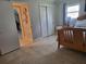 Bedroom with a wooden bed frame, light colored bedding, and an ensuite bathroom at 3912 Fontainebleau Dr, Tampa, FL 33634