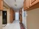 Galley kitchen with white appliances and light wood cabinets at 3912 Fontainebleau Dr, Tampa, FL 33634