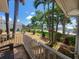 Front porch with white railing overlooks the well-manicured yard at 3912 Fontainebleau Dr, Tampa, FL 33634