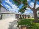 Single-Gathering home with a two-car garage and landscaped yard at 3912 Fontainebleau Dr, Tampa, FL 33634