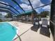 Relaxing screened pool area with dock views at 3912 Fontainebleau Dr, Tampa, FL 33634