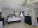 Spacious bedroom with king-size bed and ceiling fan at 3912 Fontainebleau Dr, Tampa, FL 33634