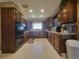 Bright kitchen with U-shaped layout, granite counters, and lots of cabinet space at 3912 Fontainebleau Dr, Tampa, FL 33634