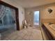 Bathroom with toilet, tub, and exterior access at 3912 Fontainebleau Dr, Tampa, FL 33634