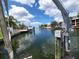 Stunning canal view with neighboring homes and boats at 3912 Fontainebleau Dr, Tampa, FL 33634