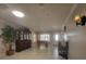 Bright entryway with foosball table, display cabinet, and tile flooring at 3912 Fontainebleau Dr, Tampa, FL 33634